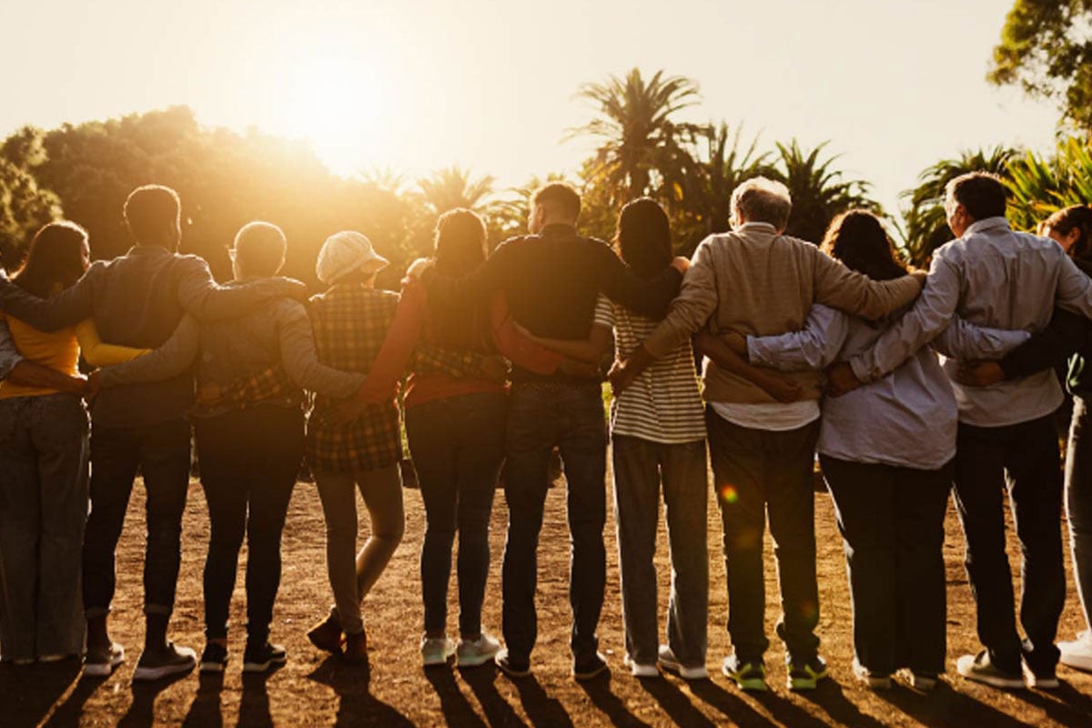Silhouetted group with arms linked in solidarity, reflecting the mission of Combined Jewish Philanthropies and its commitment to a safe, connected Jewish community in Boston.