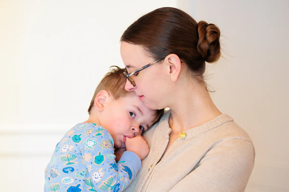 CJP staff member spending time with their young child.