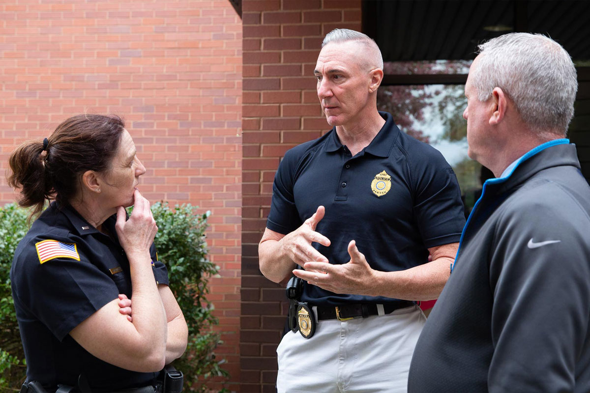 Jewish Community Safety Boston local law enforcement officials meeting outside a building, highlighting collaboration, preparedness, and community security efforts in Greater Boston.