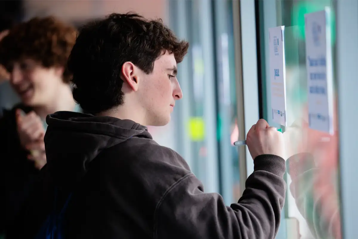 Jewish teens collaborating with sticky notes during a group workshop activity
